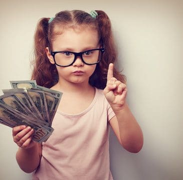little girl holding money
