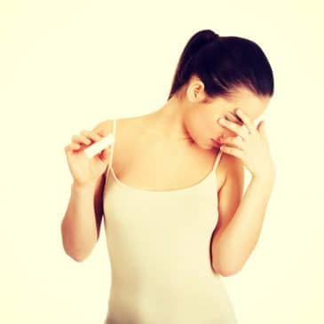woman unhappy pregnancy test