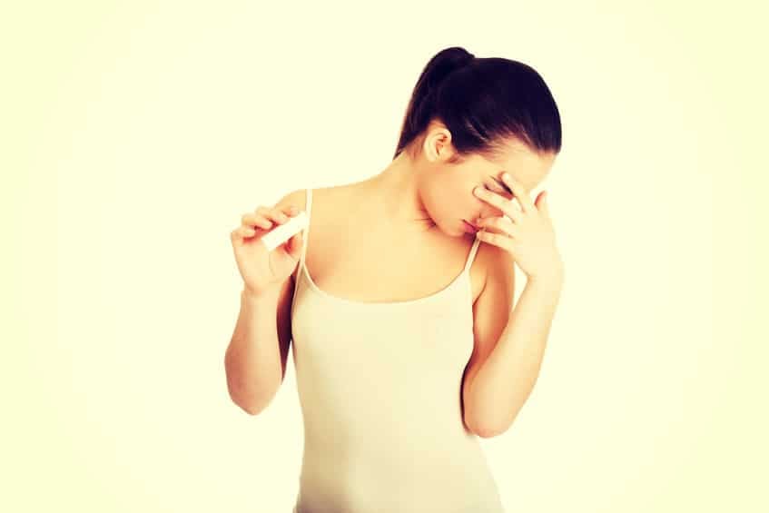woman unhappy pregnancy test