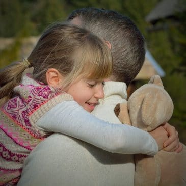 father and daughter hug
