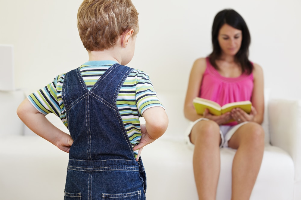 woman read while kid is waiting