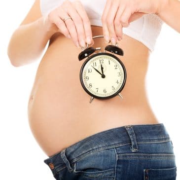 pregnant woman with clock