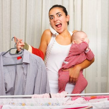 woman angry with laudry and baby
