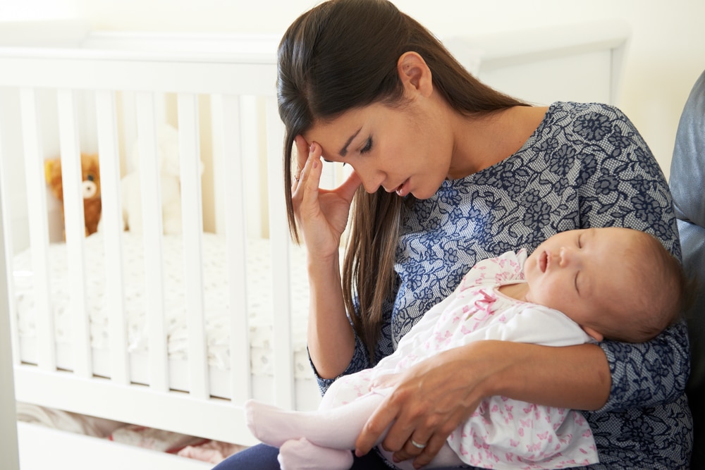 woman tired with baby