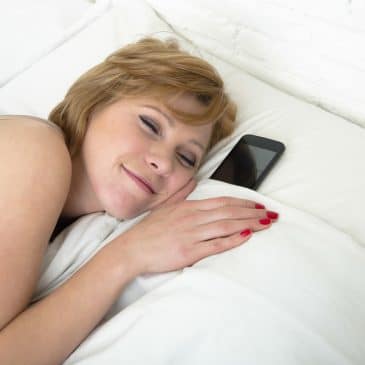 woman sleeping with cellphone