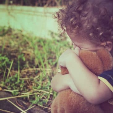 little boy holding bear
