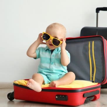 baby glass and suitcase