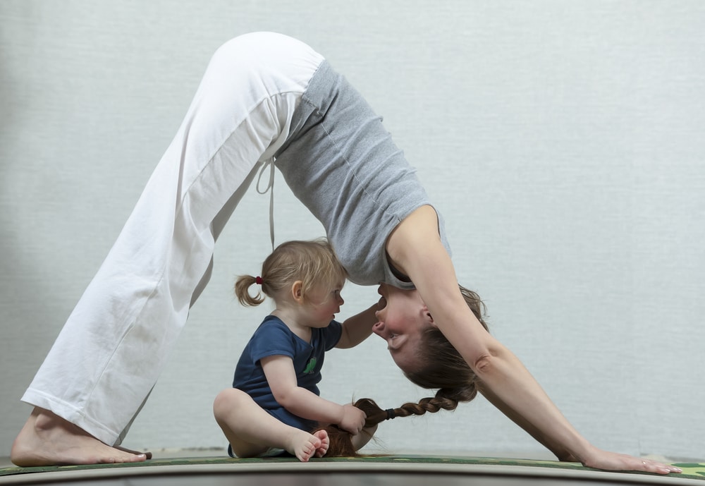 woman yoga with kid