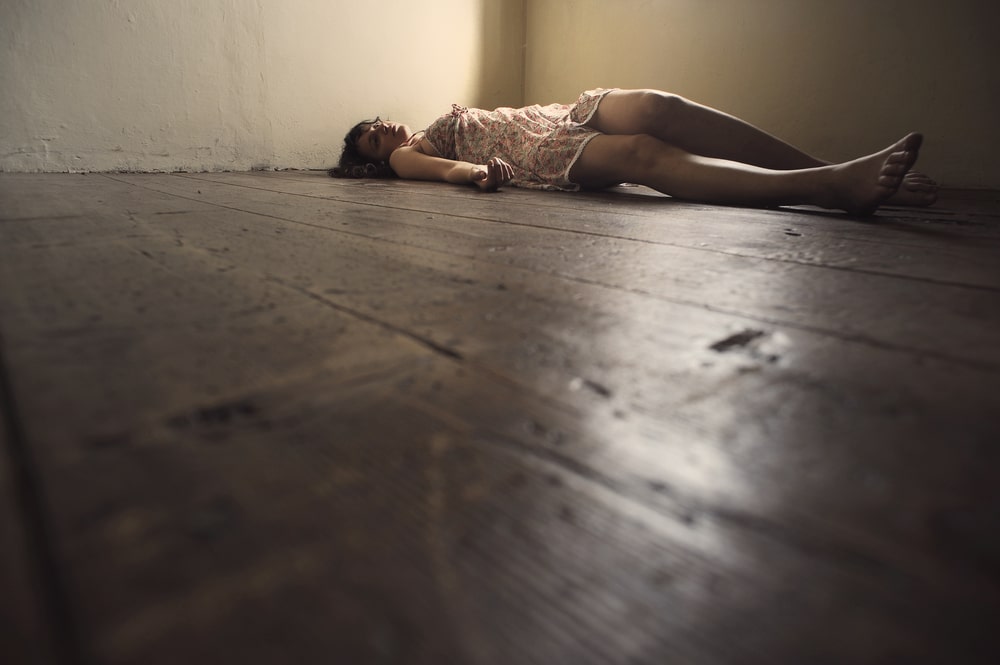 woman lying on floor