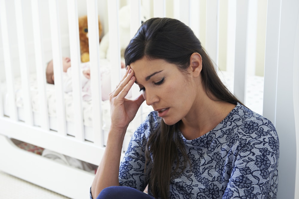 depressed woman with newborn