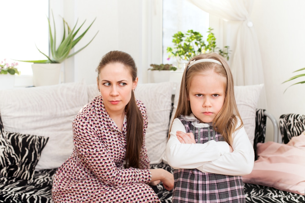 little girl angry with mother