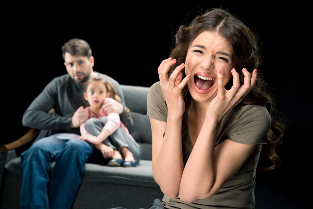 screaming woman with father and daughter