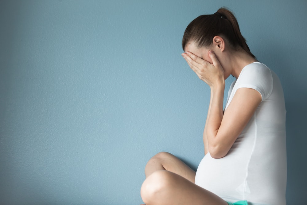 crying pregnant woman