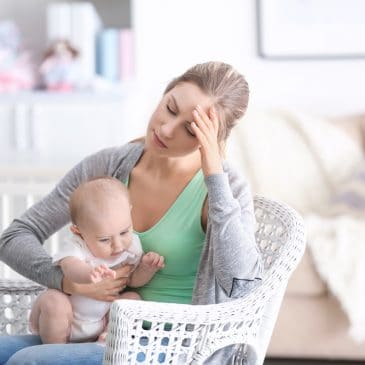 tired woman with baby