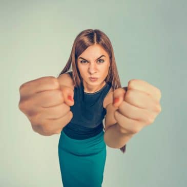 furious woman showing fist