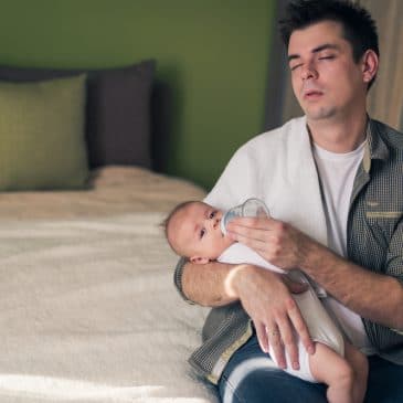 tired father with baby