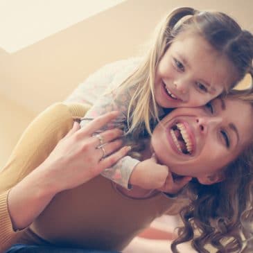 mother and daughter laugh