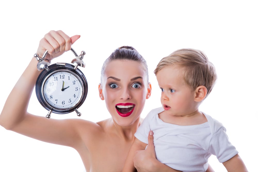 woman with clock and baby