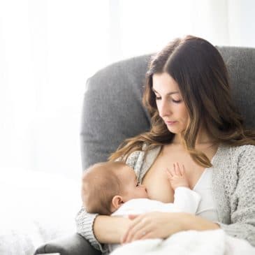 sad woman breastfeeding
