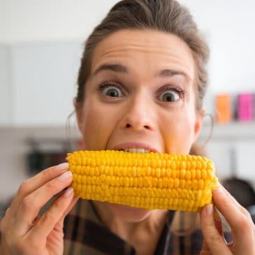 woman eat corn