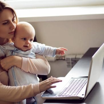 mother with computer and baby