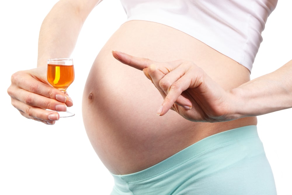 pregnant woman drinking wine