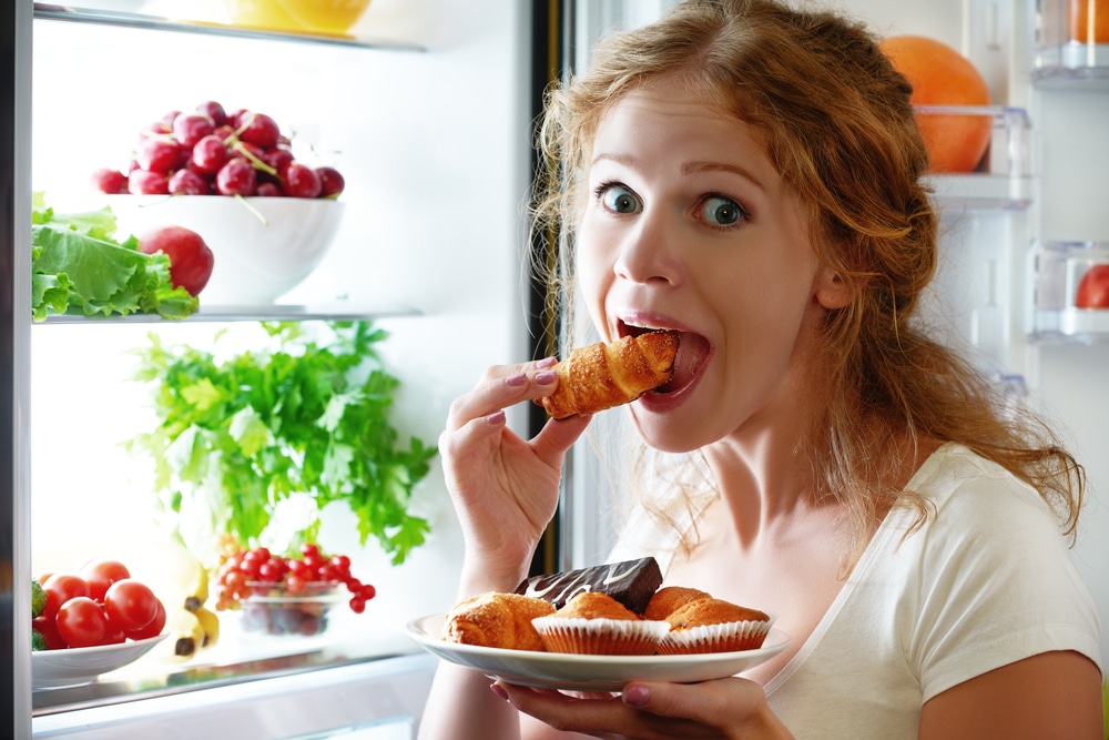 woman eat in fridge
