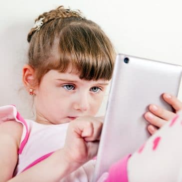 little girl on tablet