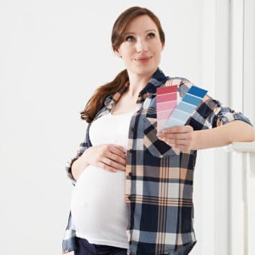 pregnant woman with blue pink paint