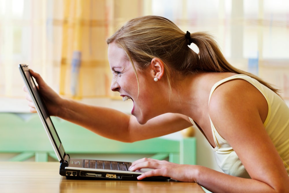 angry woman in front of computer