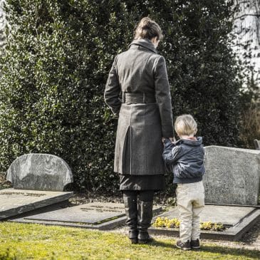 mother and son in cimetery