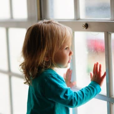 kid on window