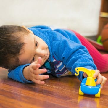 kid playing on the floor