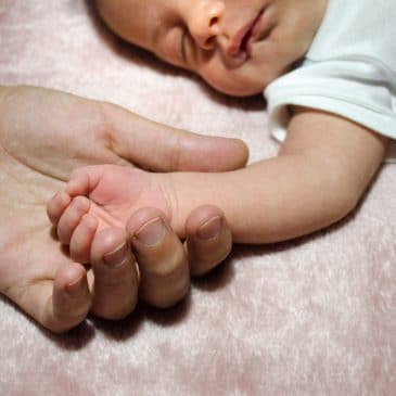 little baby hand with mother hand