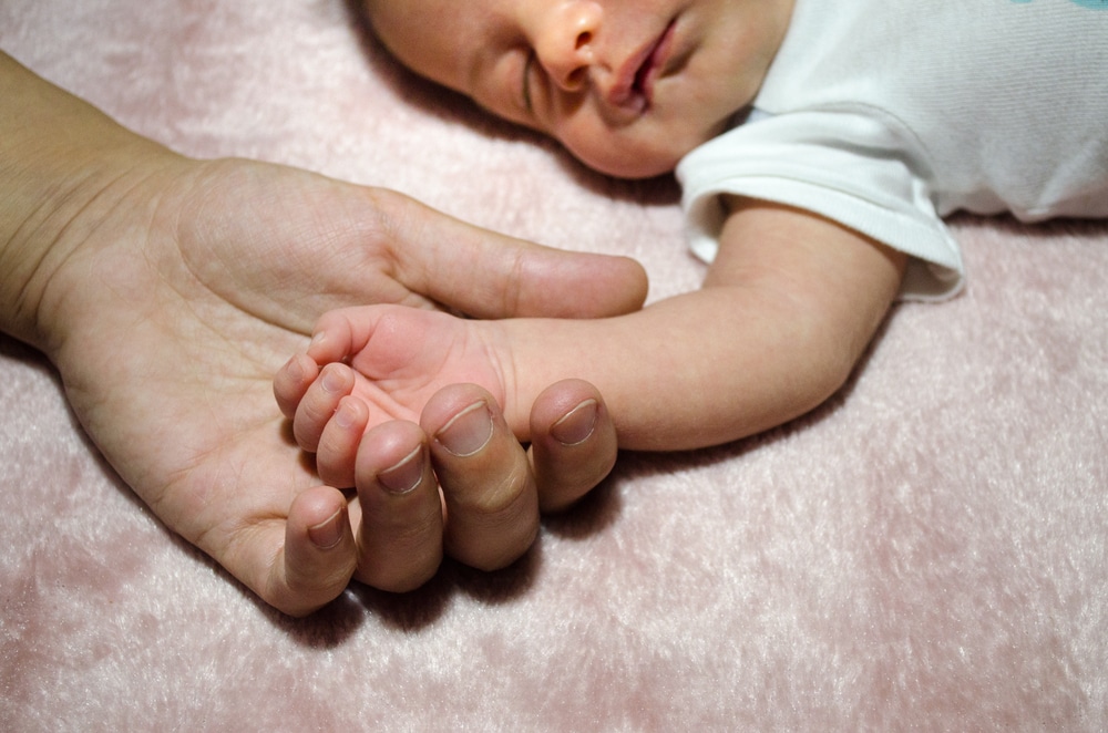 little baby hand with mother hand
