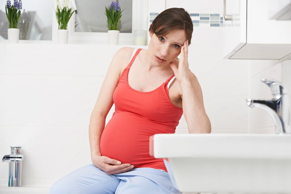 unhappy pregnant woman
