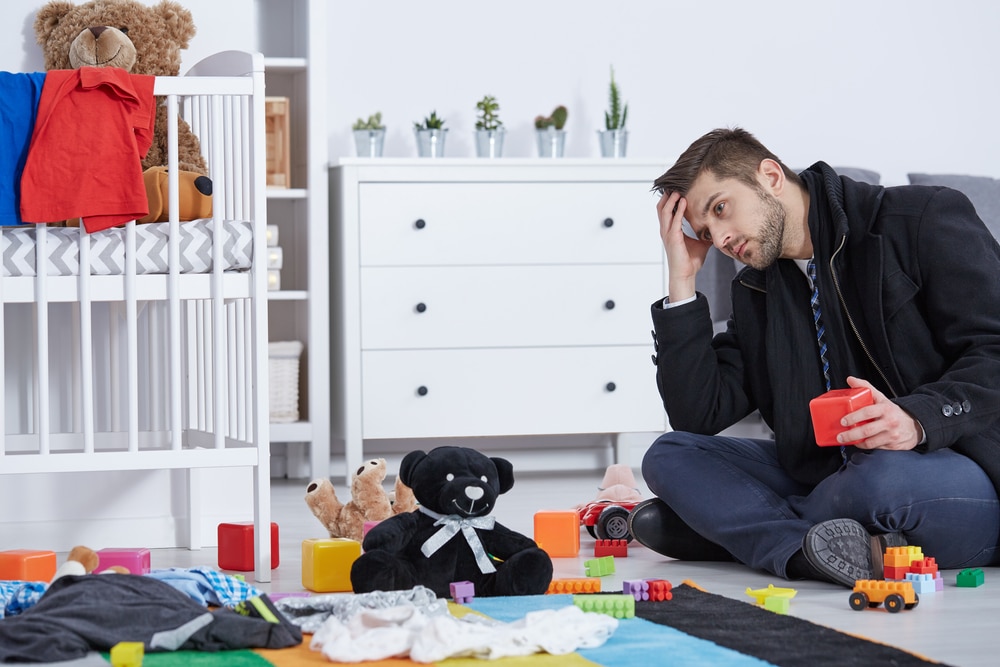 depressed father alone in kid room