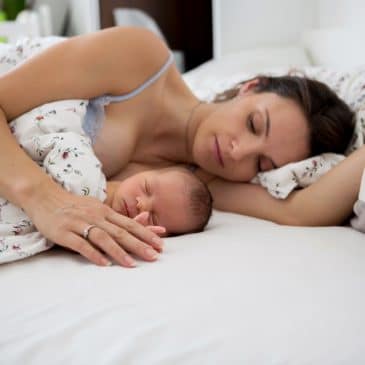 mother sleeping with baby