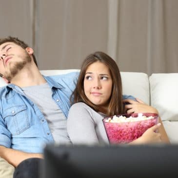 bored couple on couch