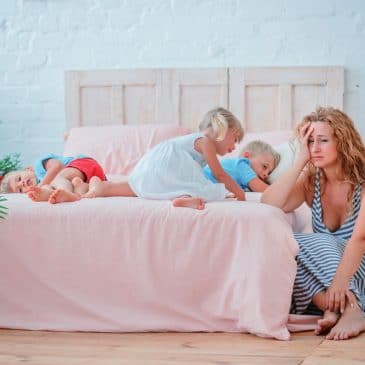 tired mother with three kids