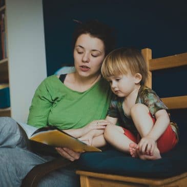 mother and kid reading a book