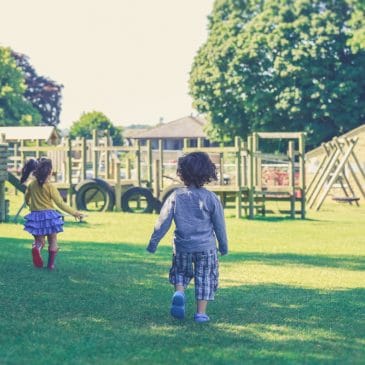 two kids run away in playground