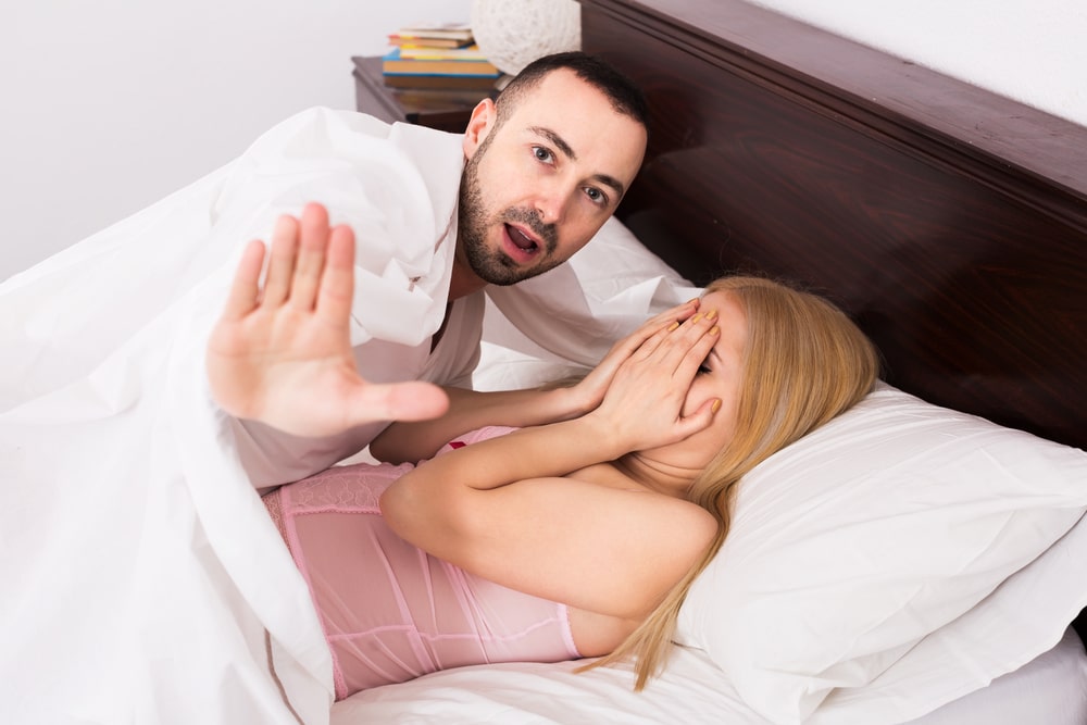 couple interrupted in bed