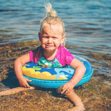 angry little girl at the beach