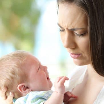 mother with baby feeling guilty