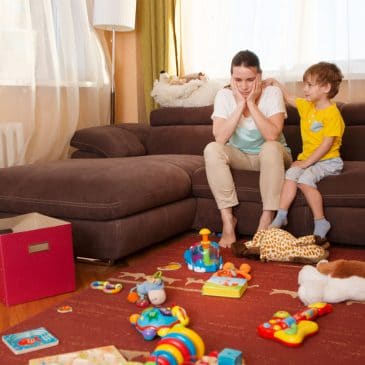 mother and kid in messy living room