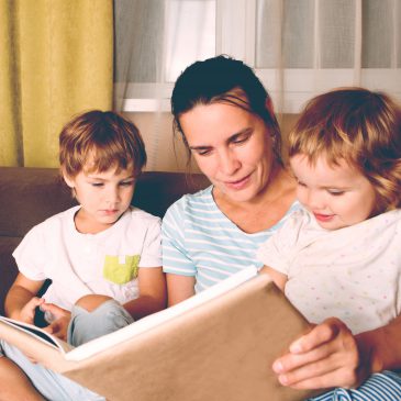 mother read book with kids