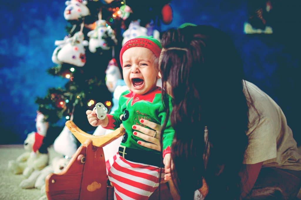 baby cry with mother xmas