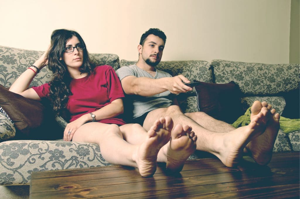 indifferent couple on couch