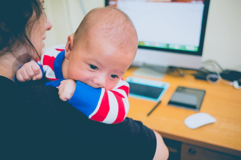 mother with baby in front of computer